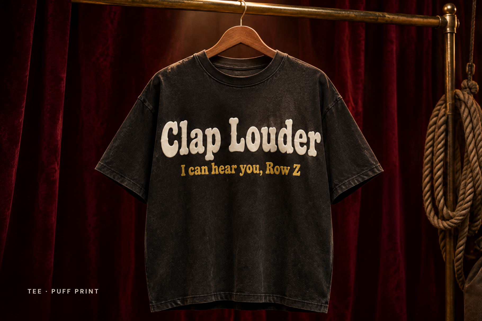 Burgundy hoodie on a hanger before red curtains, back print Encore set in Stage Velvet font