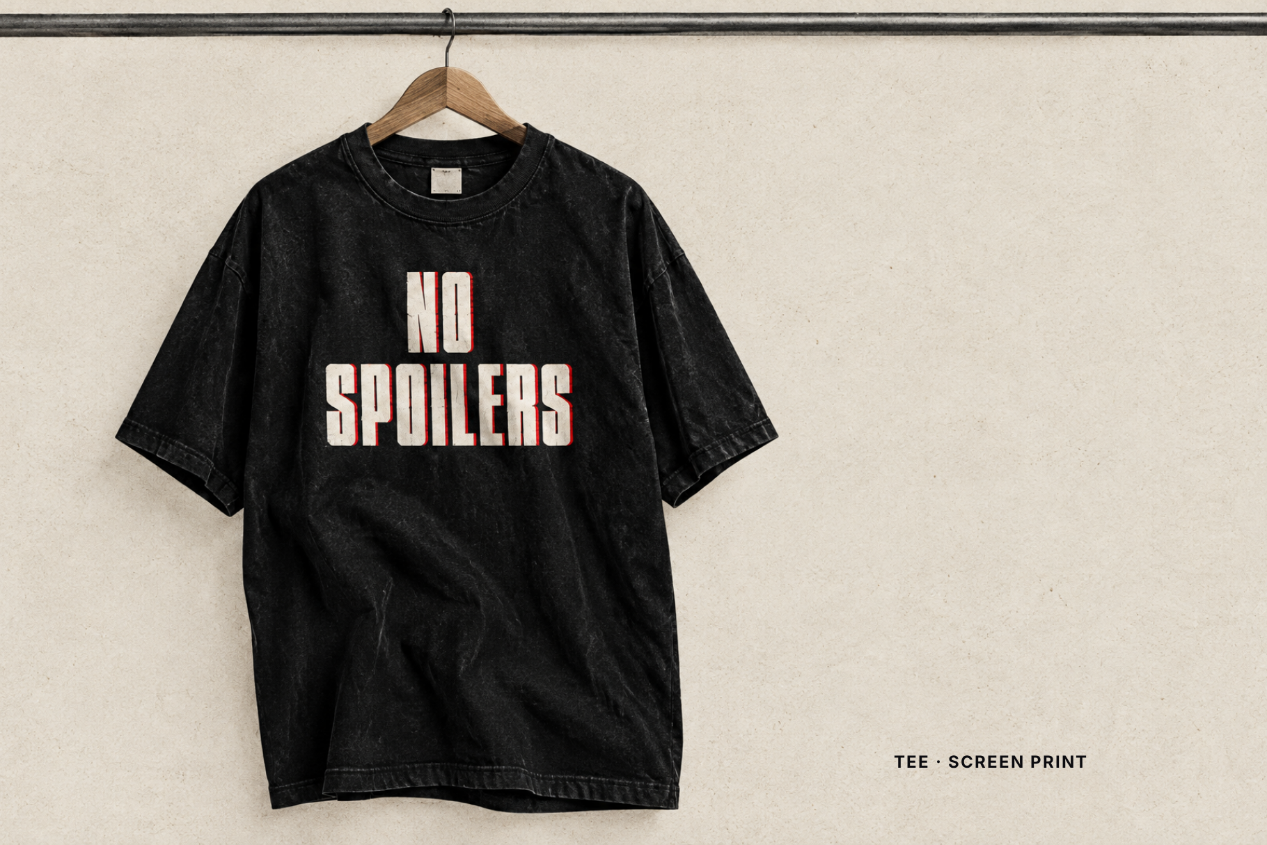 Trillforge font on a grey t-shirt mock-up with PRINTS ON ANYTHING set in the condensed capitals